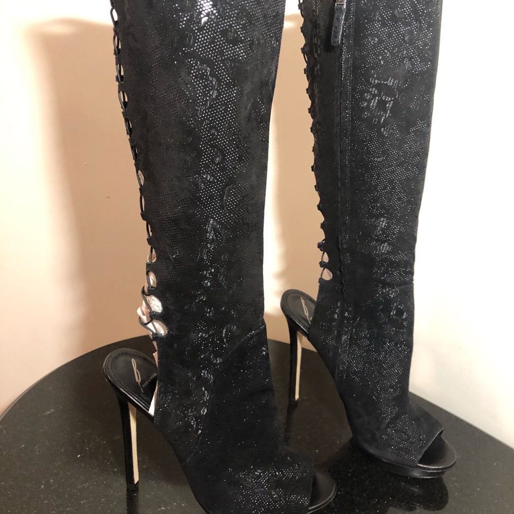 Brian Atwood tall lace boots with side zipper.